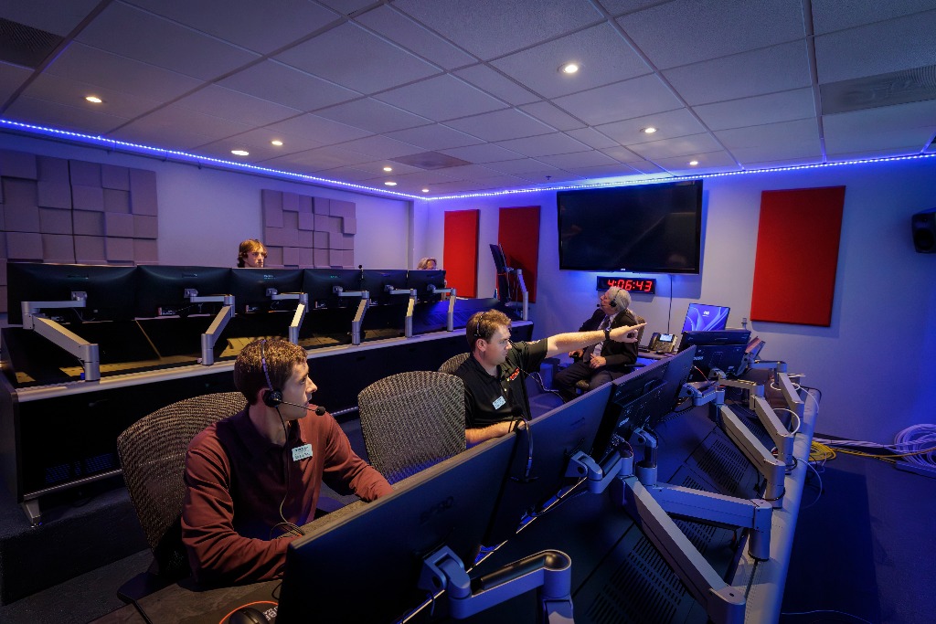 BMG Network Operations Center – operators at master control desks